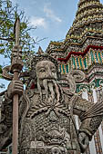 Bangkok Wat Pho, chinese style door guardians of the monumental gates of the outer walls of the temple compund.